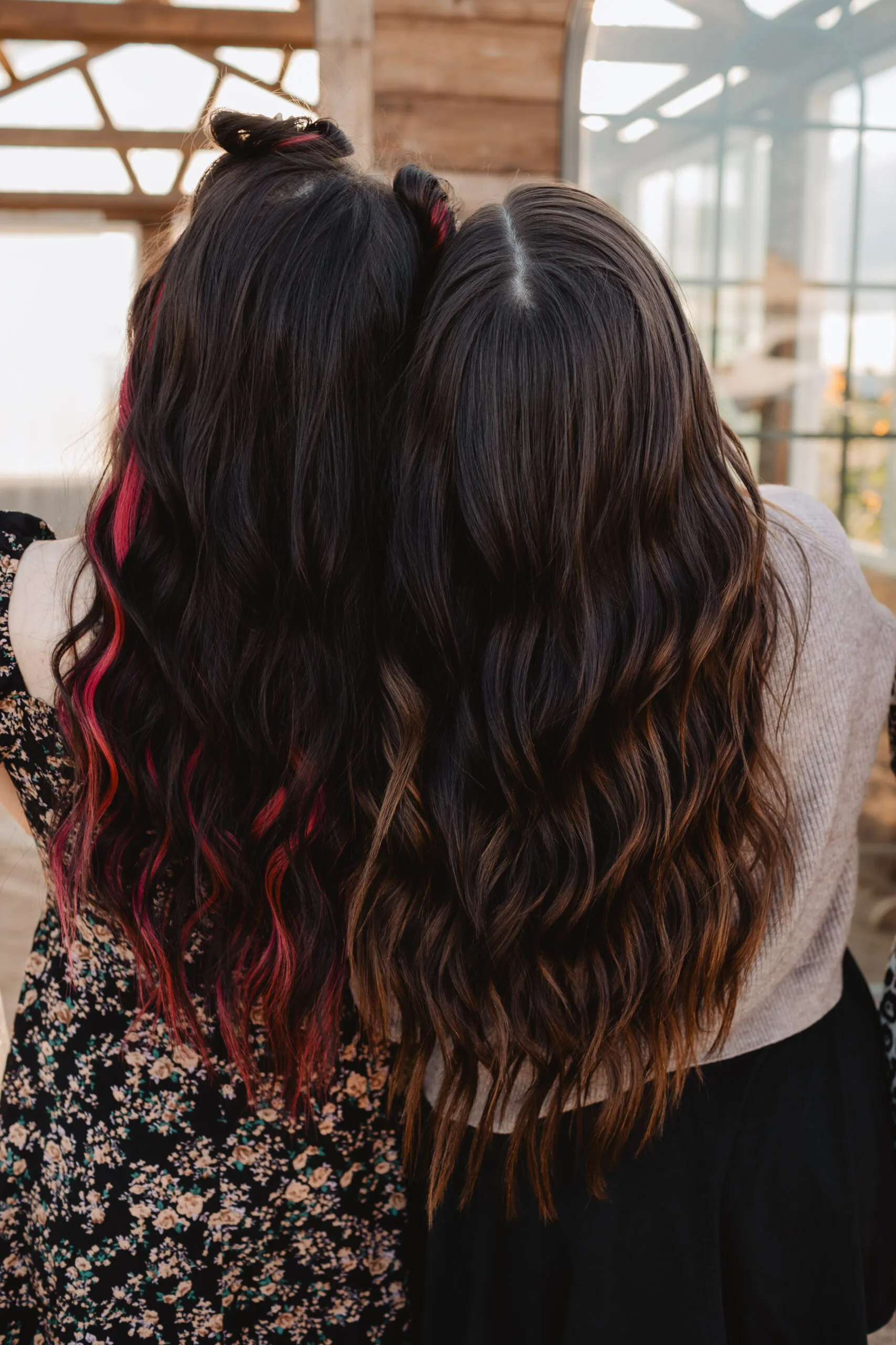 Pink peekaboo and brunette balayage color work by Elevate students