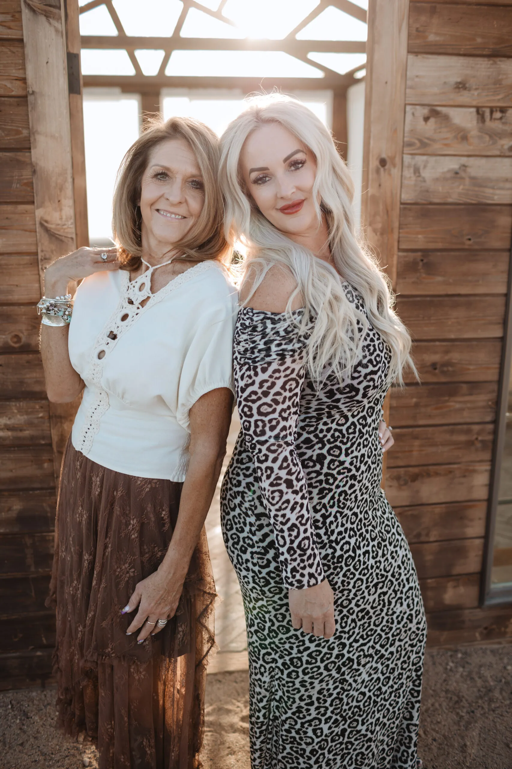 Two Elevate stylists together outdoors on a sunny day