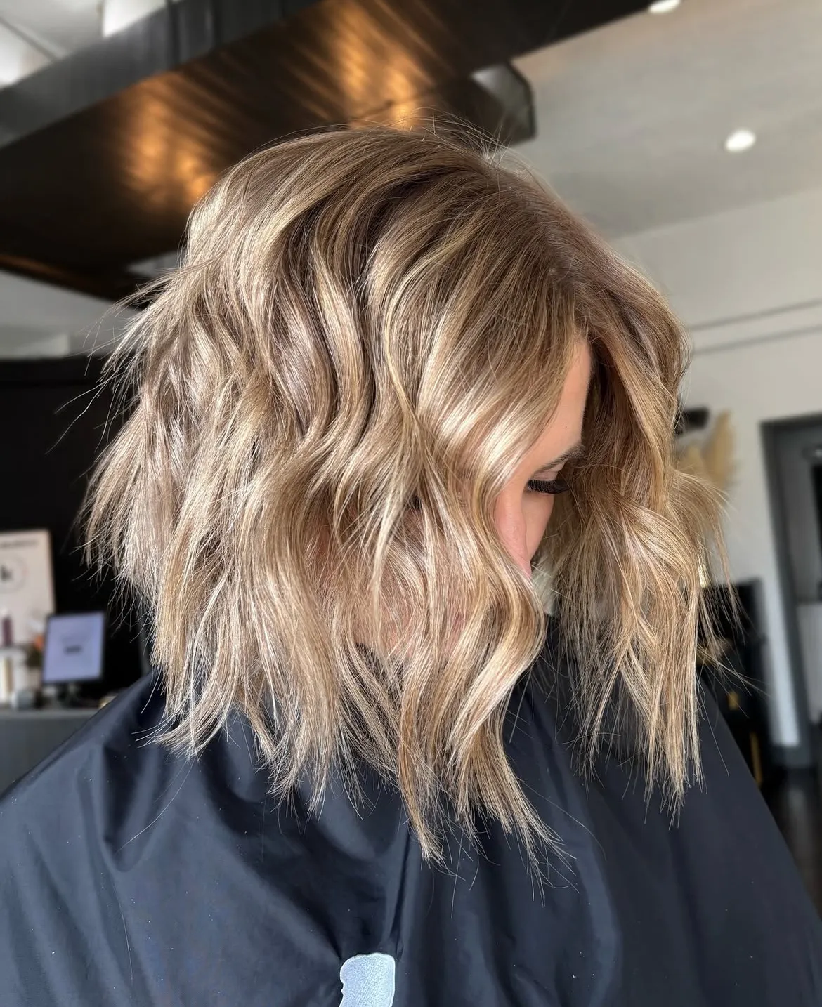 Finished blonde balayage lob styled by a student