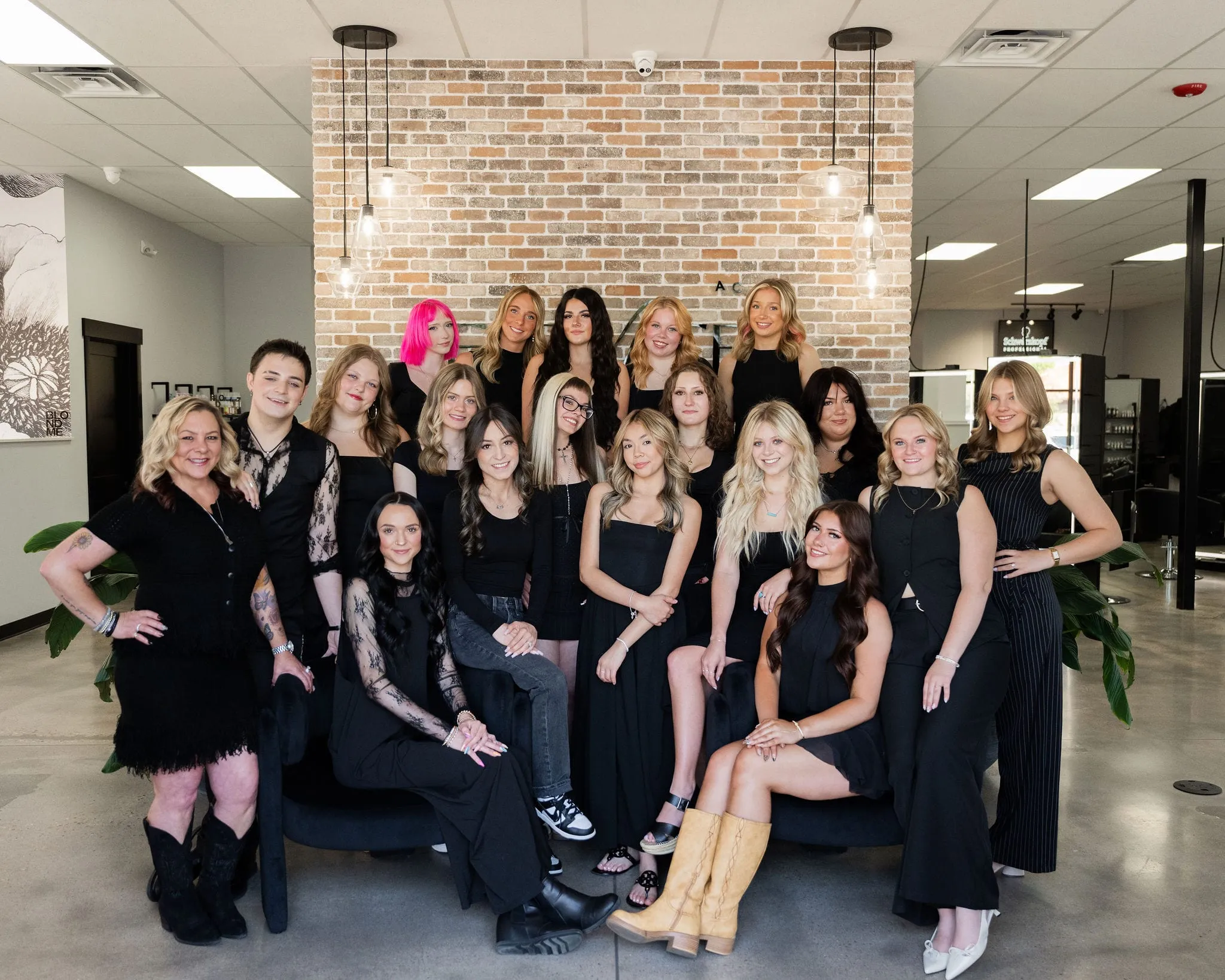 The Elevate Academy team together on the salon floor in Windsor