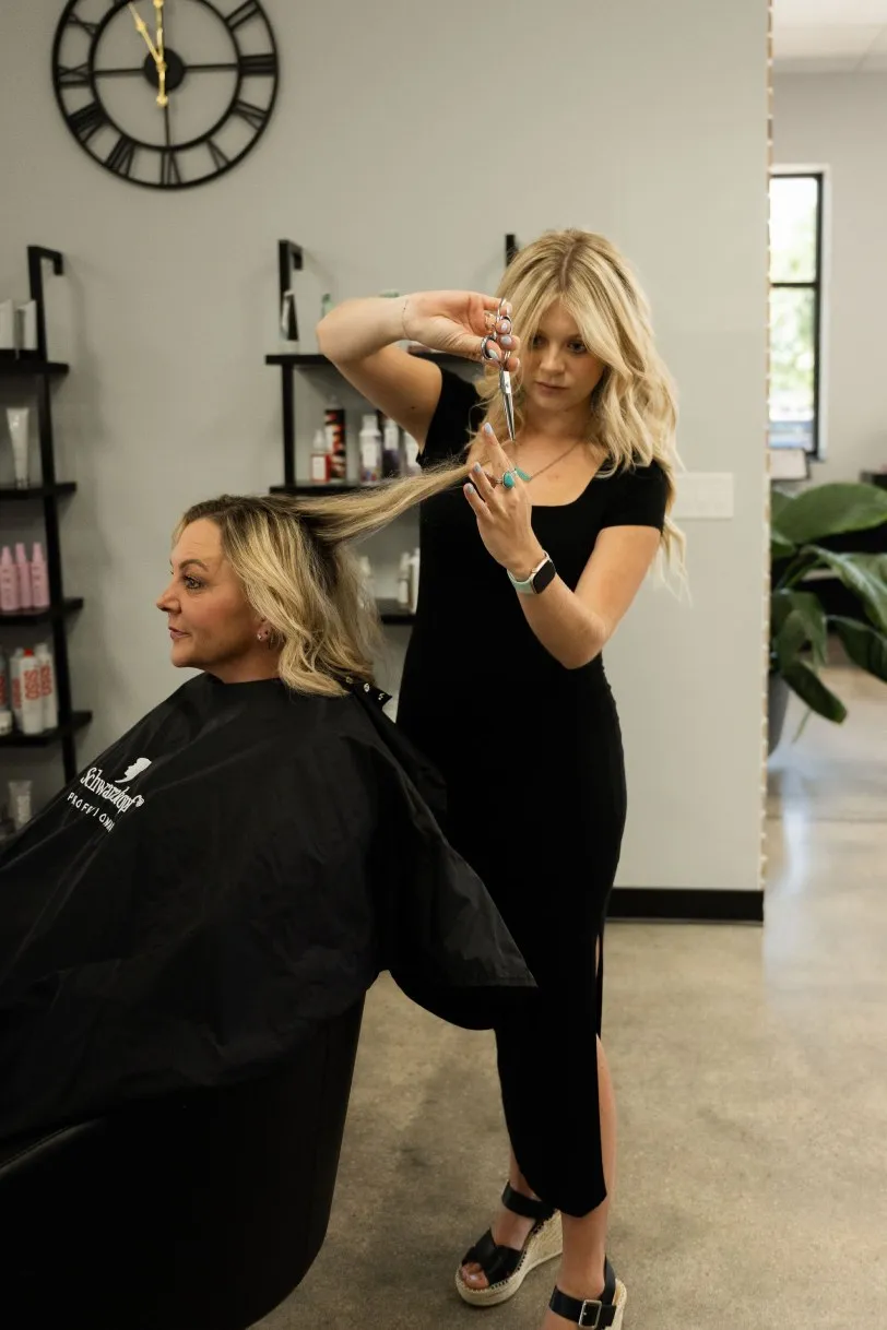 A haircut in progress on the Elevate salon floor
